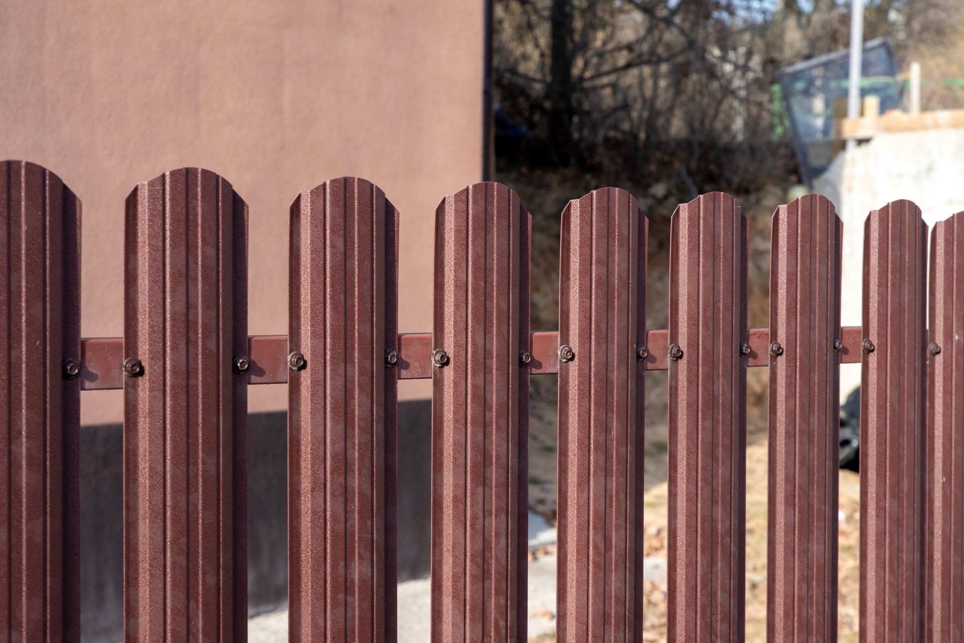 Metal picket fence and screw